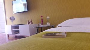 A bed or beds in a room at L'albero Di Famiglia
