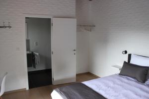 Postel nebo postele na pokoji v ubytování B&B 't Hoogste