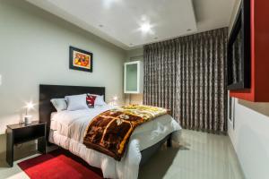 מיטה או מיטות בחדר ב-Hotel El Rubi