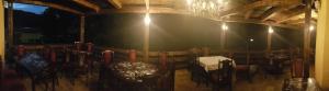 a room with a table and chairs in it at Pensiunea Mayumi Moneasa in Moneasa +80 photos