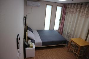 Postel nebo postele na pokoji v ubytování Blue Island Guesthouse