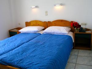 A bed or beds in a room at Hotel Helena