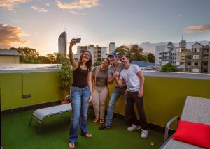 a group of people standing on a roof at Breeze Lodge in Brisbane