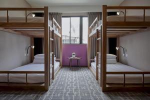 Katil atau katil-katil dalam bilik di Orange Hotel - Wenhua, Chiayi