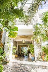 a lobby of a building with palm trees at Alamanda - Suite 46 in Palm Cove