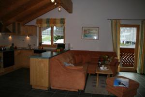 a living room with a couch and a table at Ferienwohnungen Franz Pfeifer / Beatrice Roduner in Gaschurn