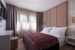 Posteľ alebo postele v izbe v ubytovaní Rooms Albachiara
