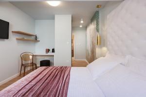 Posteľ alebo postele v izbe v ubytovaní Rooms Albachiara