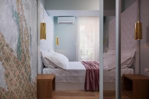 Posteľ alebo postele v izbe v ubytovaní Rooms Albachiara