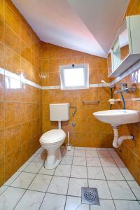 a bathroom with a toilet and a sink at Apartments Dalila in Ulcinj