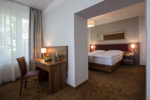 Una cama o camas en una habitación de Hotel Bellevue Tlapak