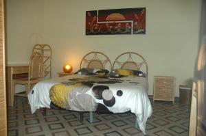 カターニアにあるDetached House "Al Vicoletto"のベッドルーム1室(ベッド1台付)