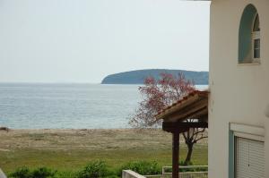 a view of the ocean from a house at Zefi's Apartment in Nea Peramos