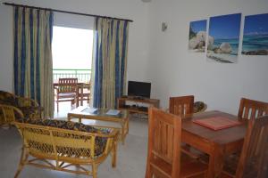 TV a/nebo společenská místnost v ubytování ManFiyo Guest House
