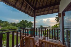 a view of the ocean from the balcony of a resort at Living Asia Resort and Spa in Senggigi
