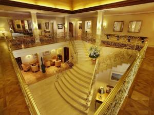 an overhead view of a spiral staircase in a building at Colombi Hotel in Freiburg im Breisgau