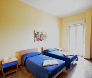 A bed or beds in a room at Dependance La Mouette