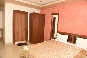 Postel nebo postele na pokoji v ubytování Hotel Pybss