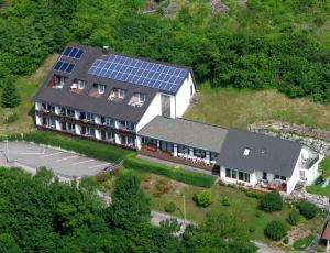 an aerial view of a house with solar panels on it at Pension Himmelreich in Glatt