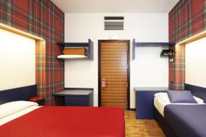 Letto o letti in una camera di Park Hotel Meublé