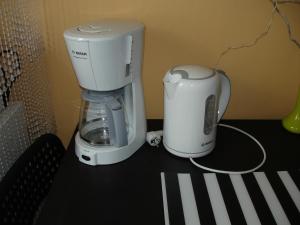 a coffee maker and a blender sitting on a counter at Apartament Central in Piatra Neamţ