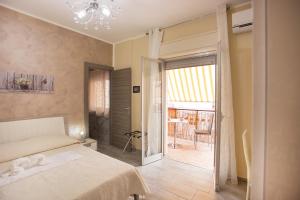 Ένα ή περισσότερα κρεβάτια σε δωμάτιο στο B&B Palermo Sole & Cultura