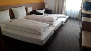 Postel nebo postele na pokoji v ubytování Hotel Relax