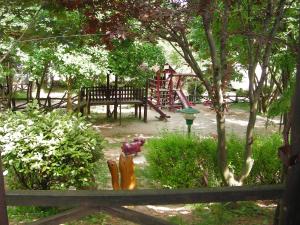 a park with a playground with a play area at Agriturismo Mezzaluna in Málchina +14 photos