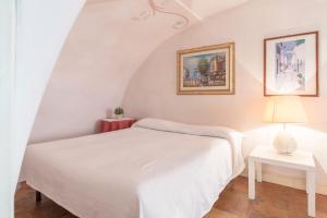 Posteľ alebo postele v izbe v ubytovaní Piazza Colonna Apartment - Charme Holidays