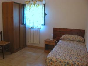 Postel nebo postele na pokoji v ubytování Montecaminetto