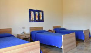 A bed or beds in a room at Dependance La Mouette