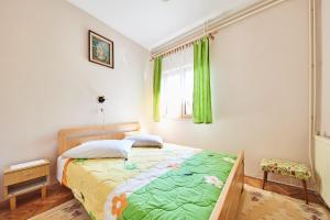 Postel nebo postele na pokoji v ubytování Apartment Erika