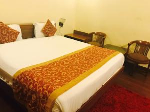 Postel nebo postele na pokoji v ubytování Skylink Suites Bed & Breakfast