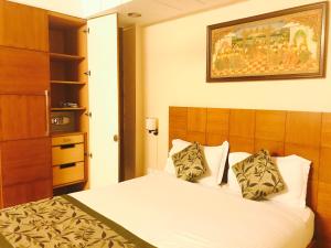 Postel nebo postele na pokoji v ubytování Skylink Suites Bed & Breakfast