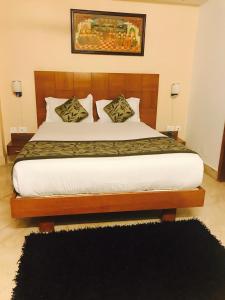 Postel nebo postele na pokoji v ubytování Skylink Suites Bed & Breakfast