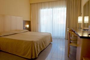 Postel nebo postele na pokoji v ubytování Albergo Mediterraneo