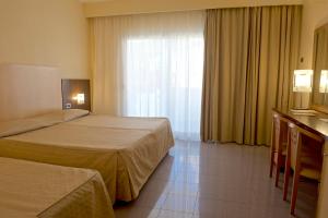 Postel nebo postele na pokoji v ubytování Albergo Mediterraneo