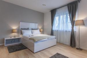 Postel nebo postele na pokoji v ubytování Priuli Luxury Rooms