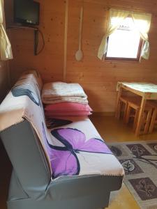 Ένα ή περισσότερα κρεβάτια σε δωμάτιο στο Wynajem Domkow Letniskowych