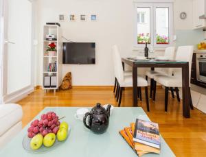 TV a/nebo společenská místnost v ubytování La Vita e Bella Apartment