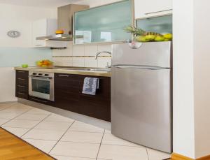 Kuchyň nebo kuchyňský kout v ubytování La Vita e Bella Apartment