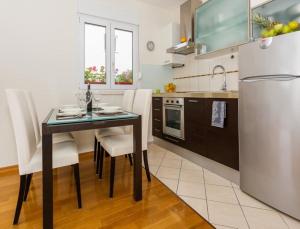 Kuchyň nebo kuchyňský kout v ubytování La Vita e Bella Apartment