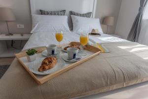 Postel nebo postele na pokoji v ubytování Priuli Luxury Rooms