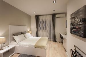 Postel nebo postele na pokoji v ubytování Priuli Luxury Rooms
