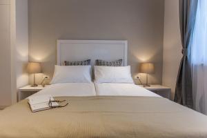 Postel nebo postele na pokoji v ubytování Priuli Luxury Rooms