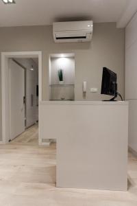 TV a/nebo společenská místnost v ubytování Priuli Luxury Rooms
