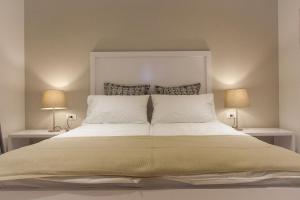 Postel nebo postele na pokoji v ubytování Priuli Luxury Rooms