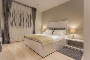 Postel nebo postele na pokoji v ubytování Priuli Luxury Rooms