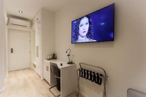 TV a/nebo společenská místnost v ubytování Priuli Luxury Rooms