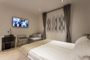 Postel nebo postele na pokoji v ubytování Priuli Luxury Rooms